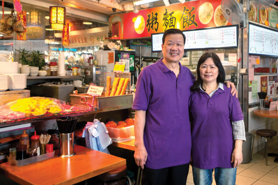Cooked food stall tenant 朱镇波 serves up hot food at Link REIT Tai Yuen Market.